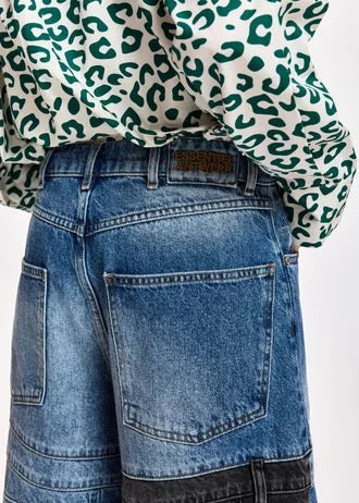 Dark blue and black dual-panel patchwork denim shorts