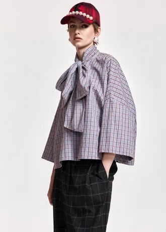 Light blue and dark red checked pussy-bow top with trumpet sleeves