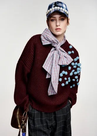 Burgundy and blue pompon-embellished knitted sweater